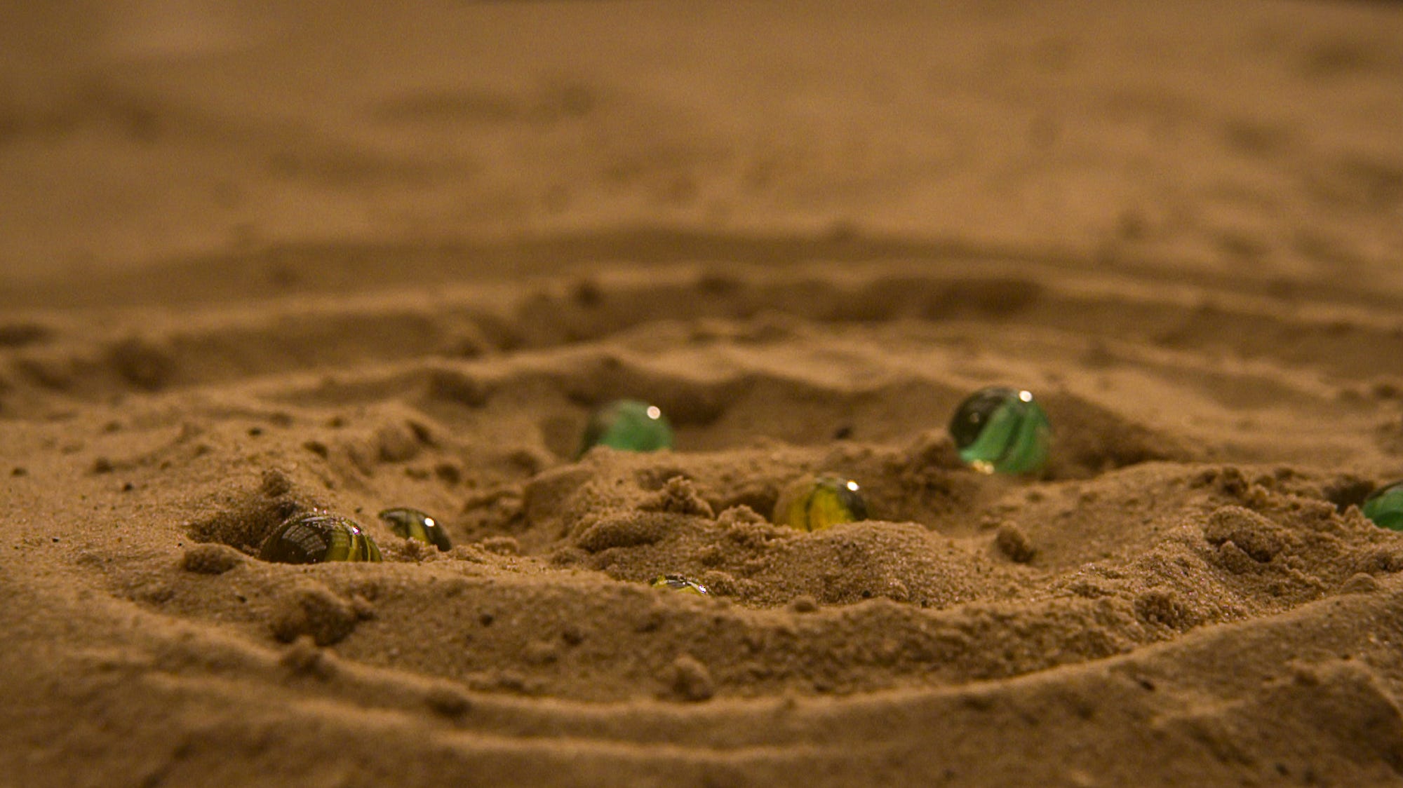 Marbles in sand