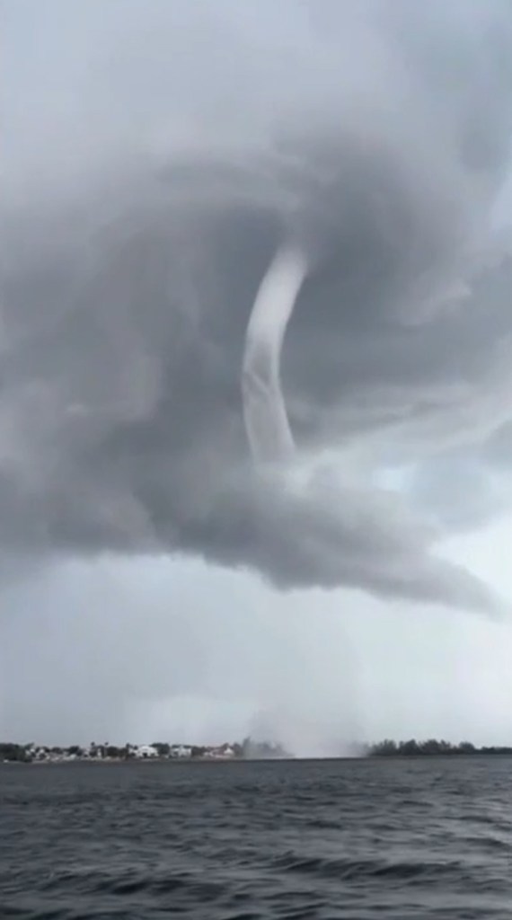 Dual waterspouts over water.