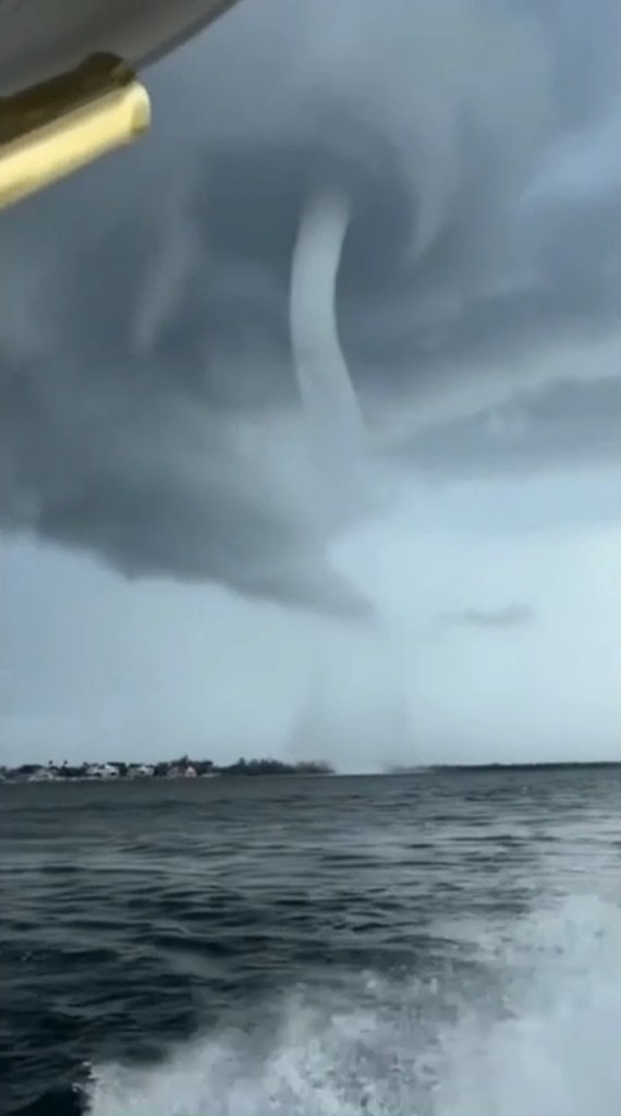 Dual waterspouts over water.