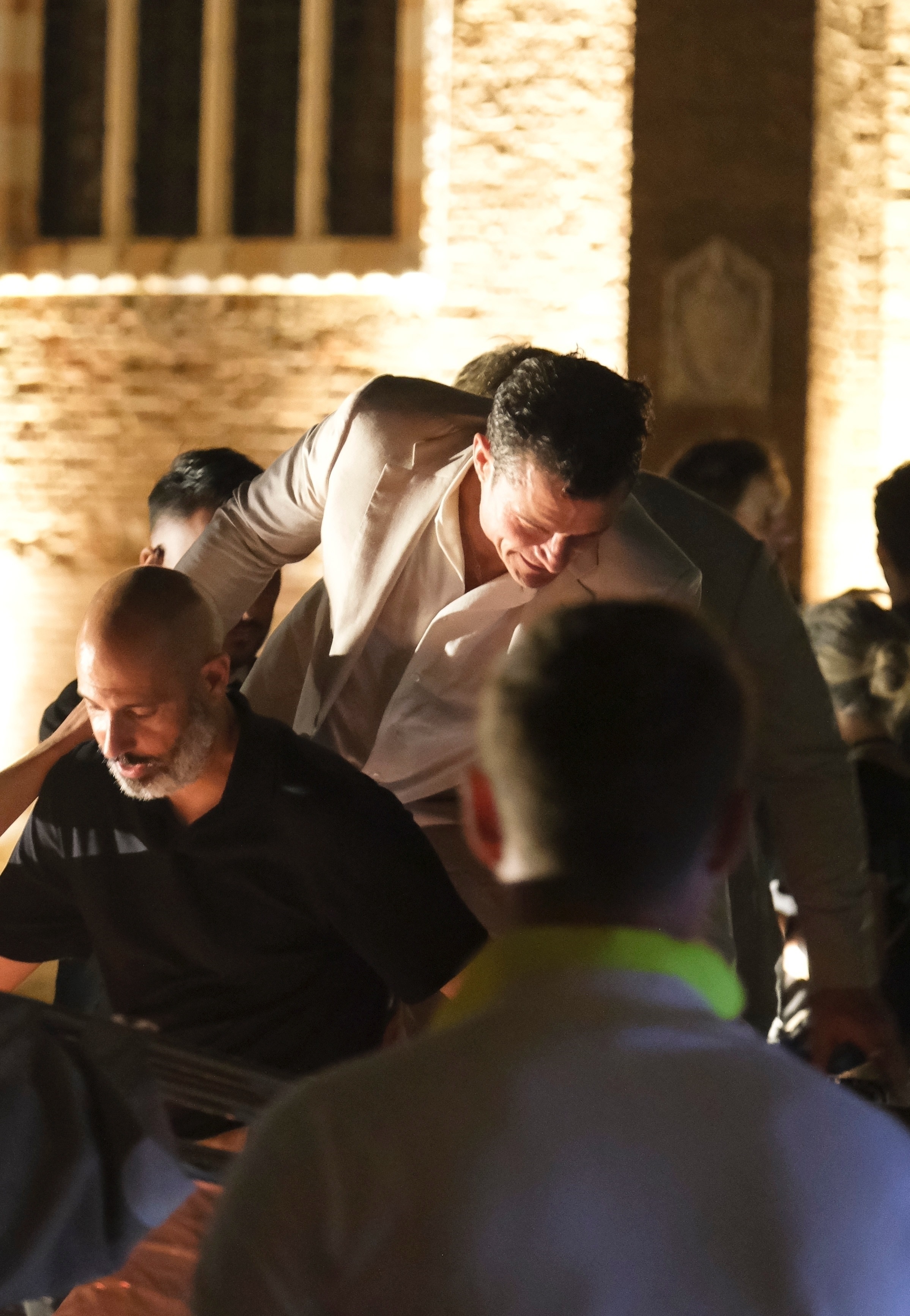 Orlando Bloom leaves Jeff Bezos and Lauren Sánchez's pre-wedding party with other guests.