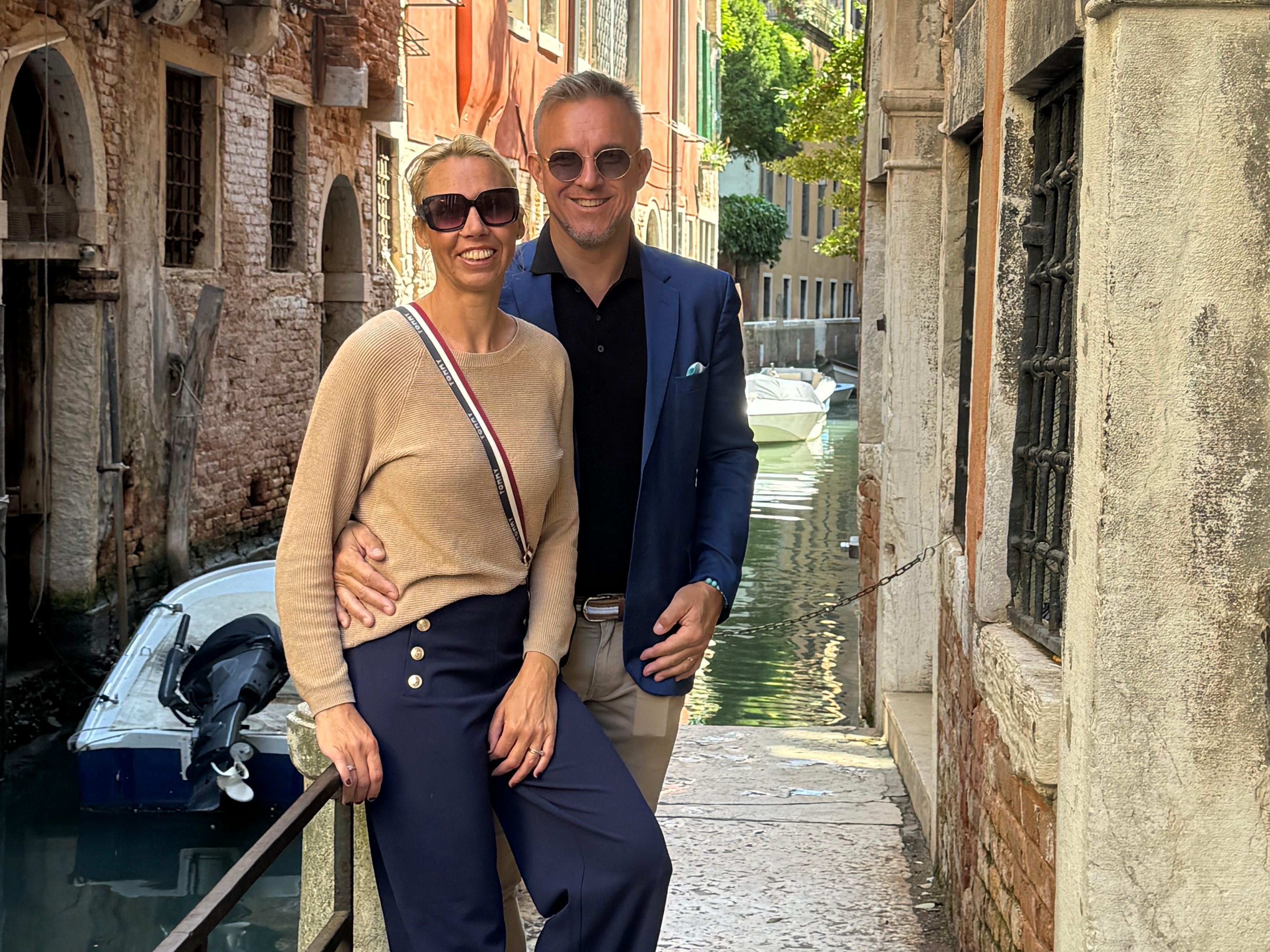 a couple pose for a photo in Europe
