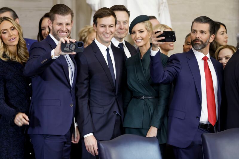 Lara Trump, Eric Trump, Jared Kushner, Elon Musk, Ivanka Trump, and Donald Trump Jr. pose for photos after the inauguration of Donald Trump on Jan. 20.
