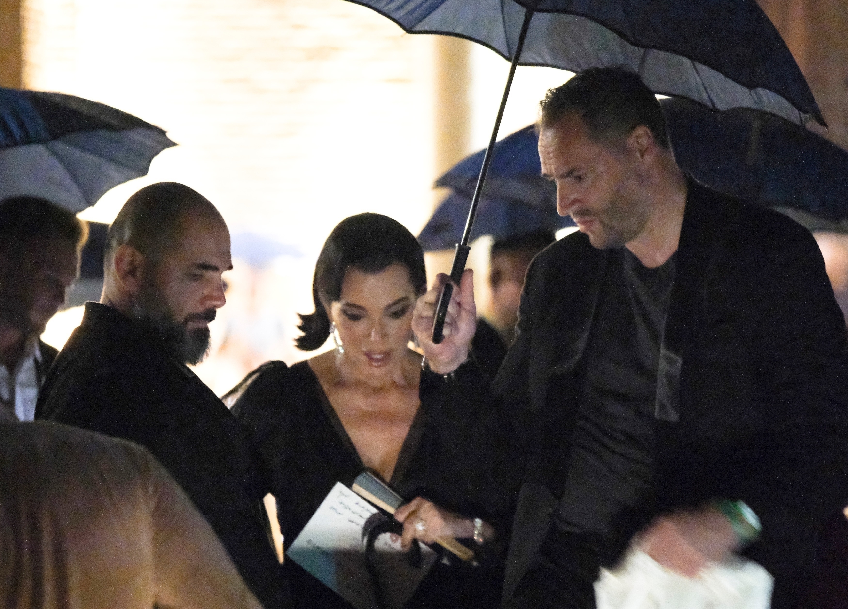 Kris Jenner leaves Jeff Bezos and Lauren Sanchez's pre-wedding party during crazy thunderstorm.