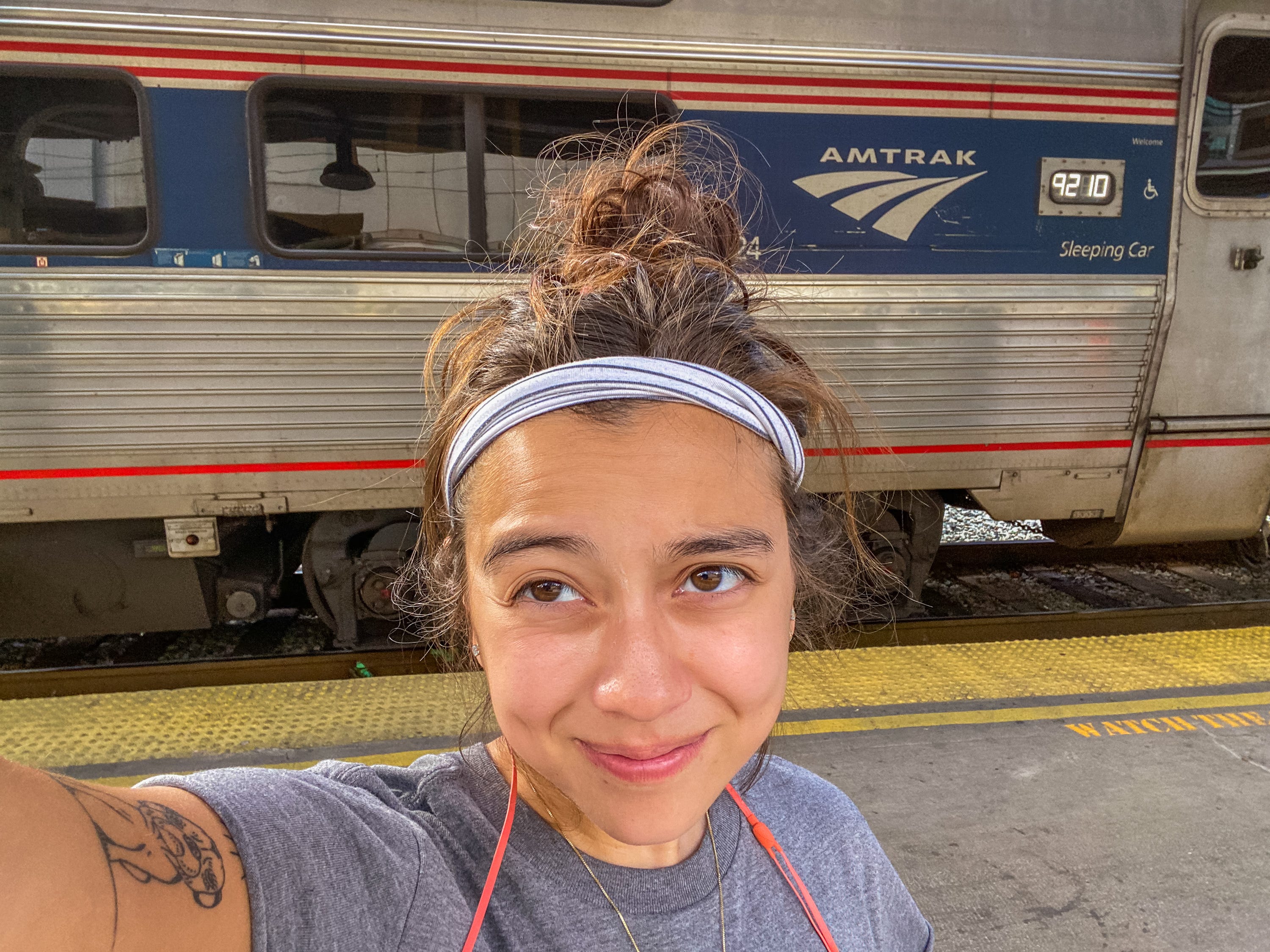 The author takes a selfie in front of an Amtrak sleeper train