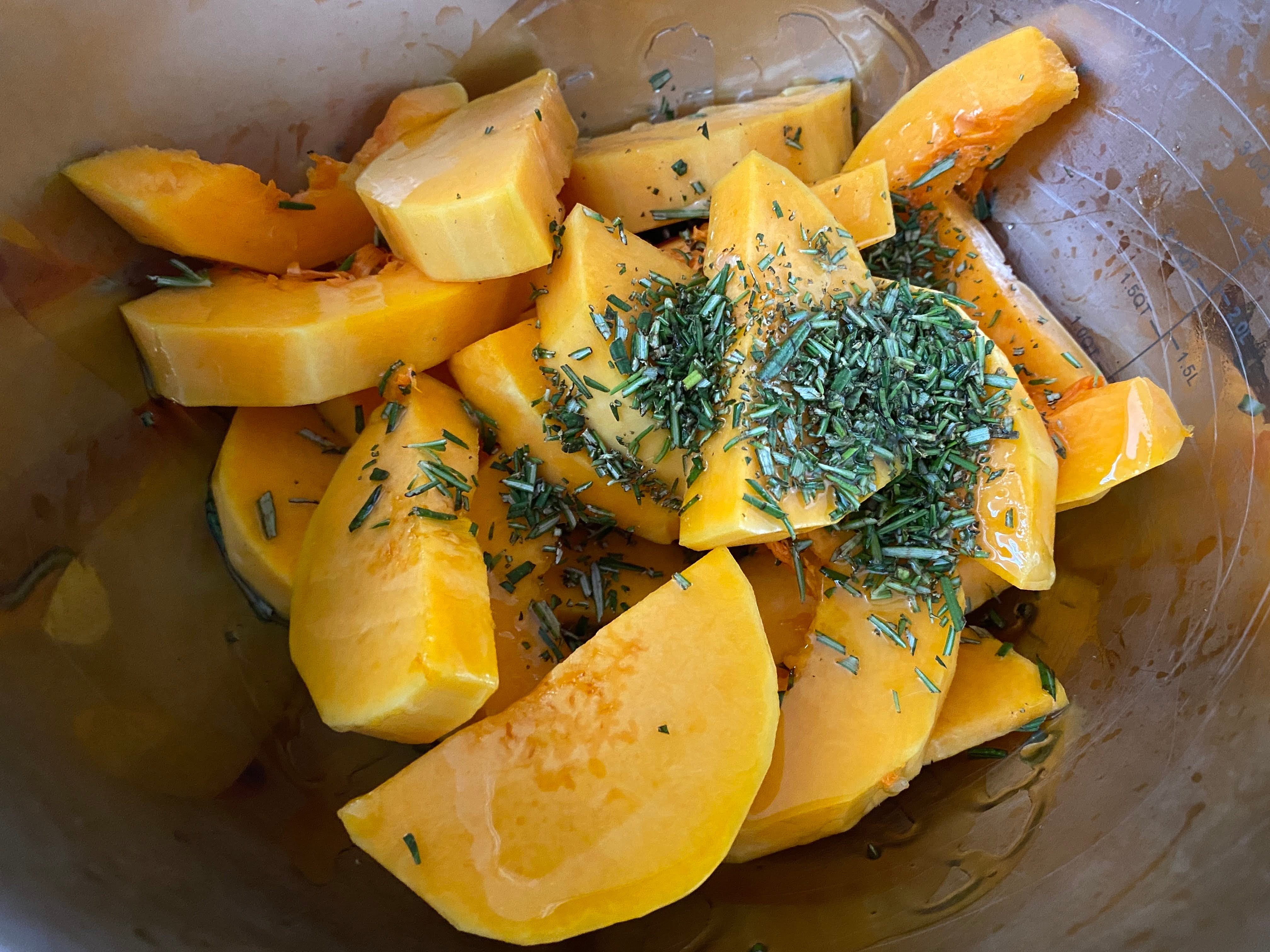 A photo of butternut squash seasoned with rosemary