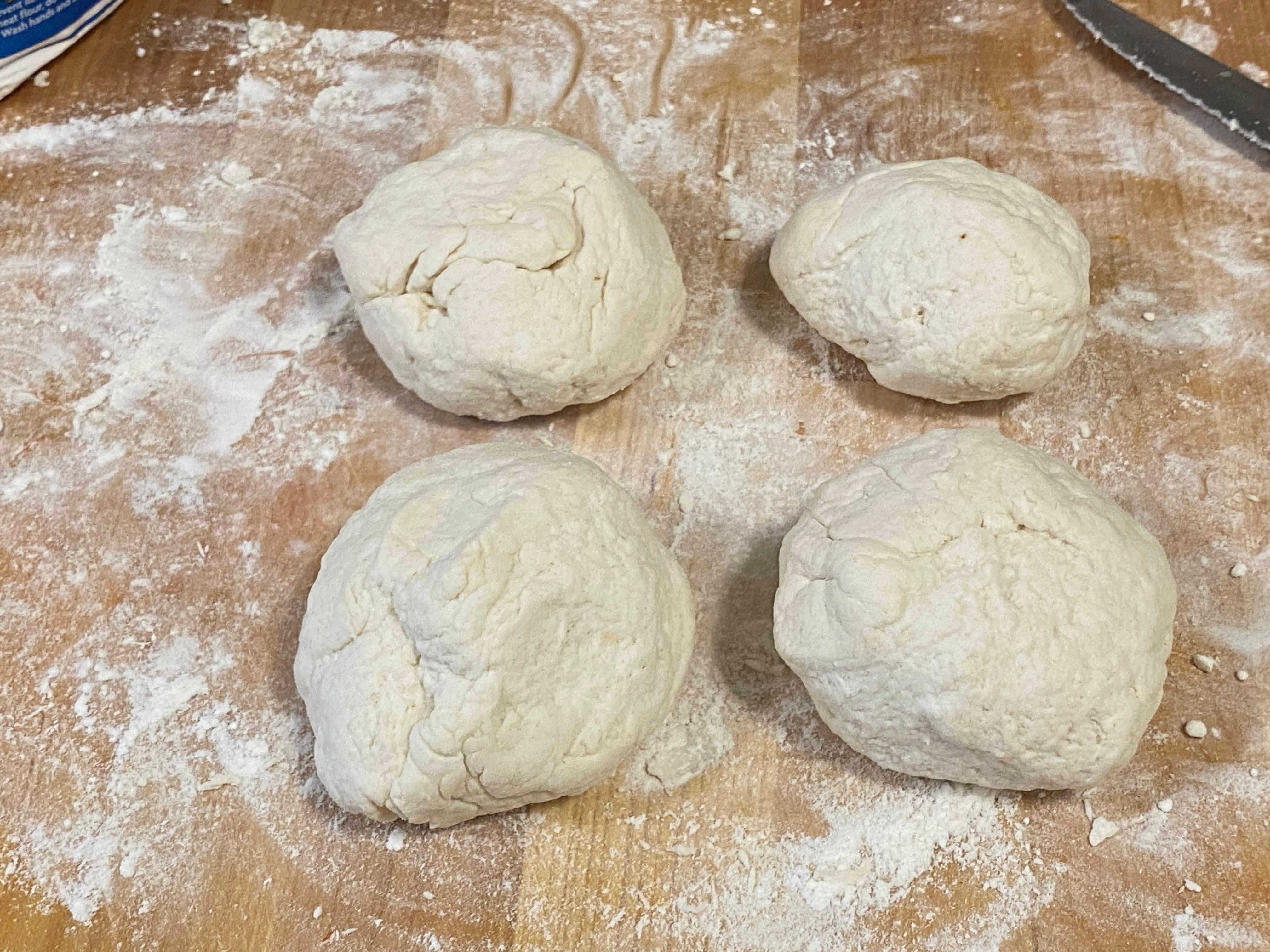 A photo of bagel dough on a floured surface