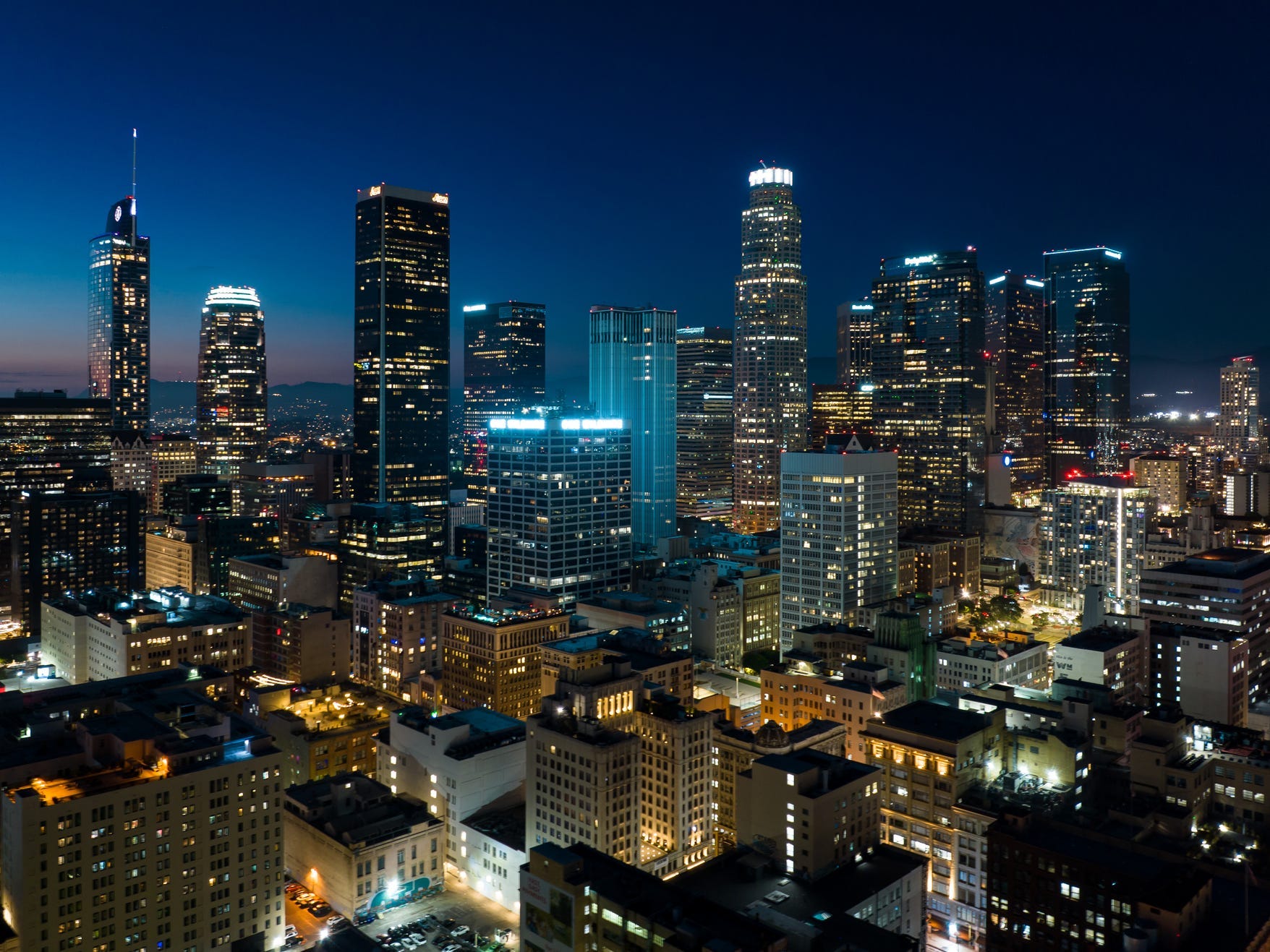 Aerial view of the downtown Los Angeles skyline at night.