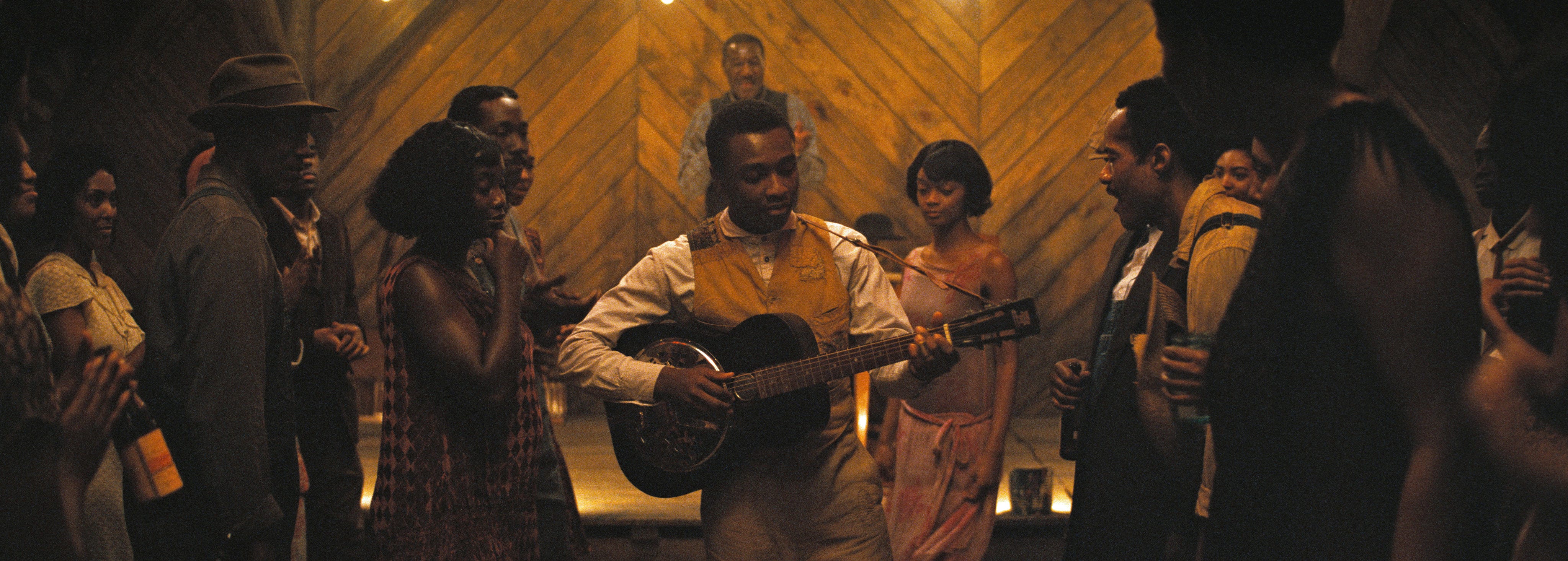 Miles Canton playing a guitar