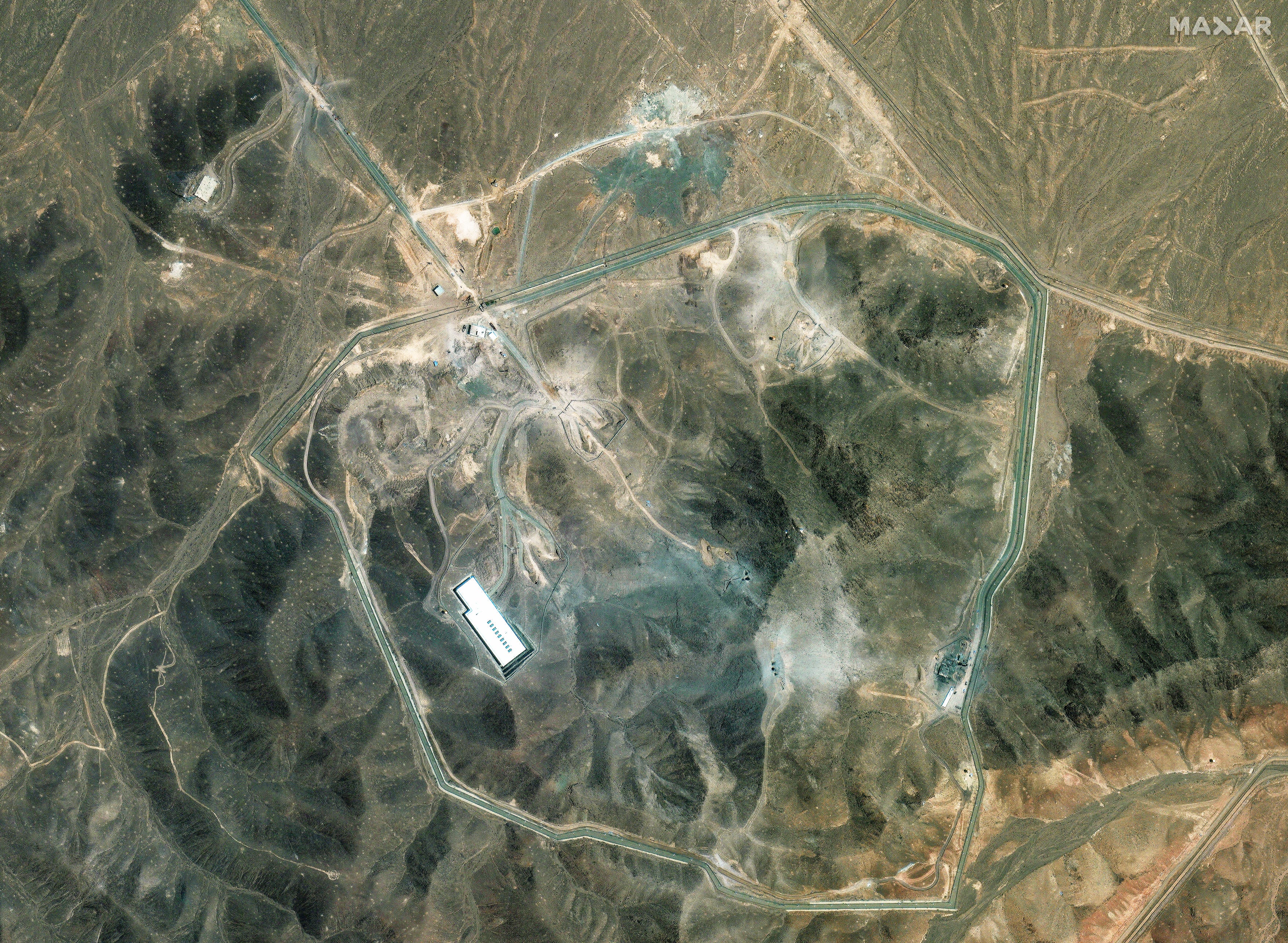 A satellite image of Iran's Fordow nuclear facility in the mountains.