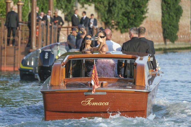 VENICE, ITALY - JUNE 27: Kim and Khloe Kardashian leave the Gritti hotel to go to the island of San Giorgio Maggiore to attend the wedding of Jeff Bezos and Lauren Sanchez on June 27, 2025 in Venice, Italy. (Photo by Stefano Mazzola/GC Images)