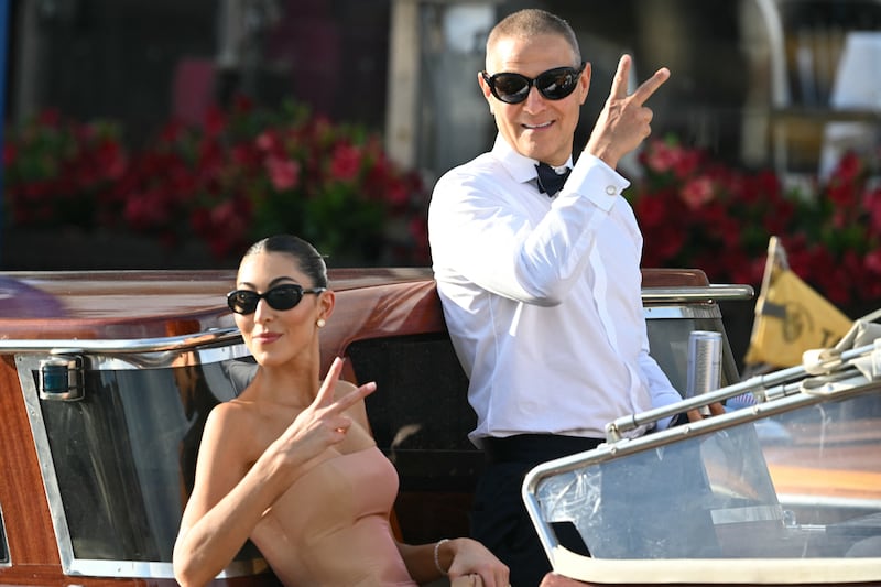 US fashion designer Sarah Staudinger and US talent agent Ari Emanuel leave the Gritti Palace Hotel on the wedding day of Amazon founder Jeff Bezos with Lauren Sanchez, in Venice on June 27, 2025. (Photo by Stefano Rellandini / AFP) (Photo by STEFANO RELLANDINI/AFP via Getty Images)
