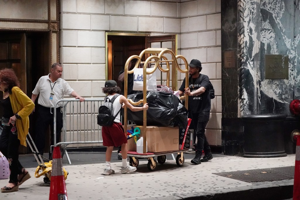 Migrants moving out of the Roosevelt Hotel in New York City.