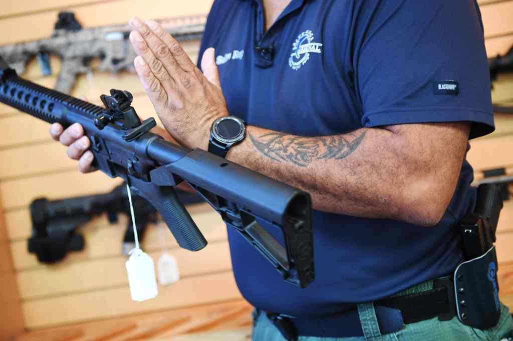 Person holding a rifle.