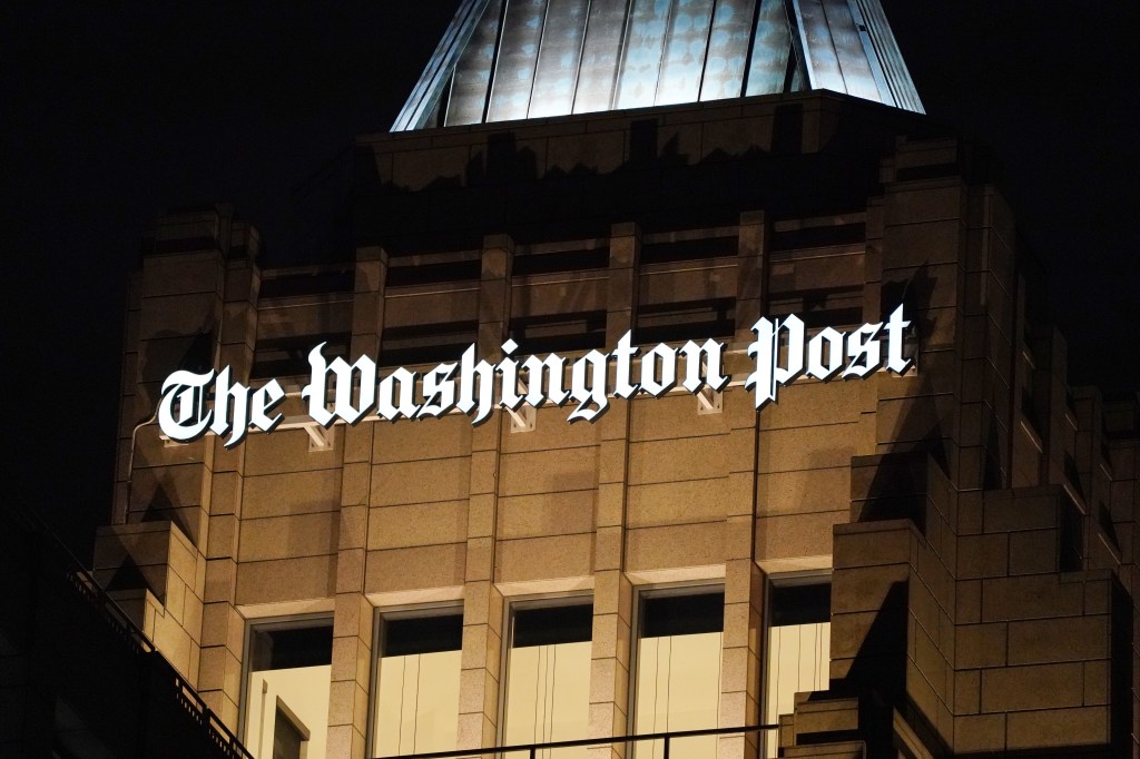 The Washington Post building at night.