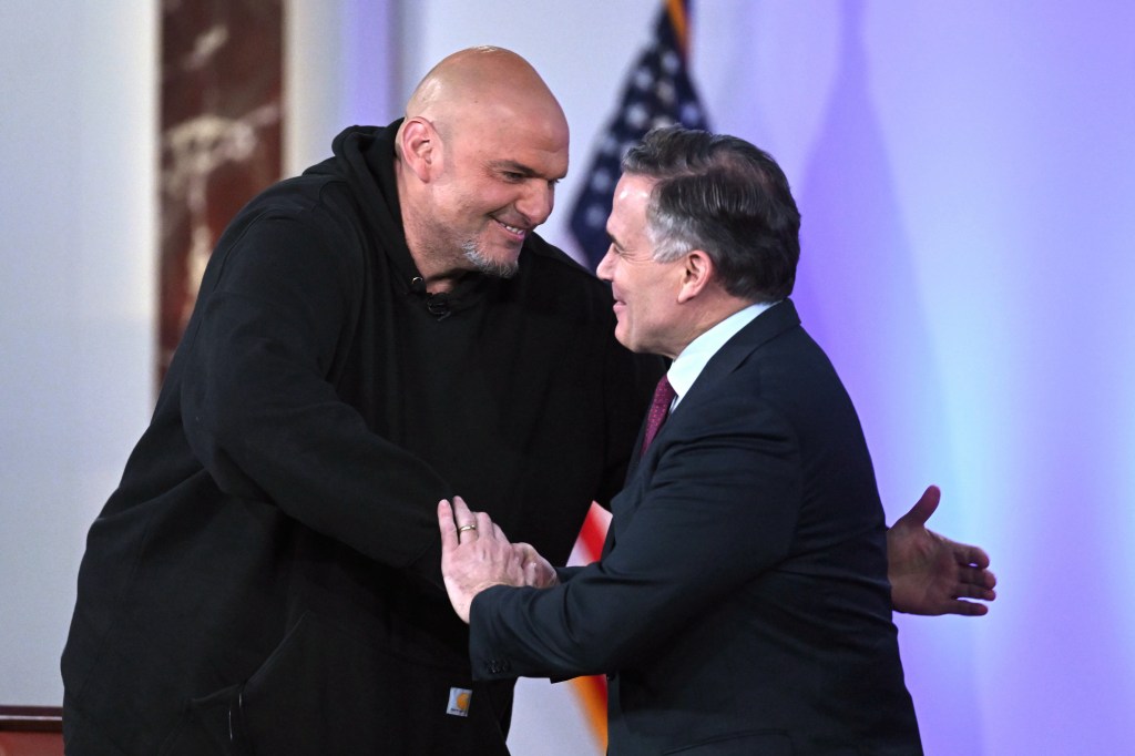 Two men shaking hands at a Pennsylvania Senate debate.