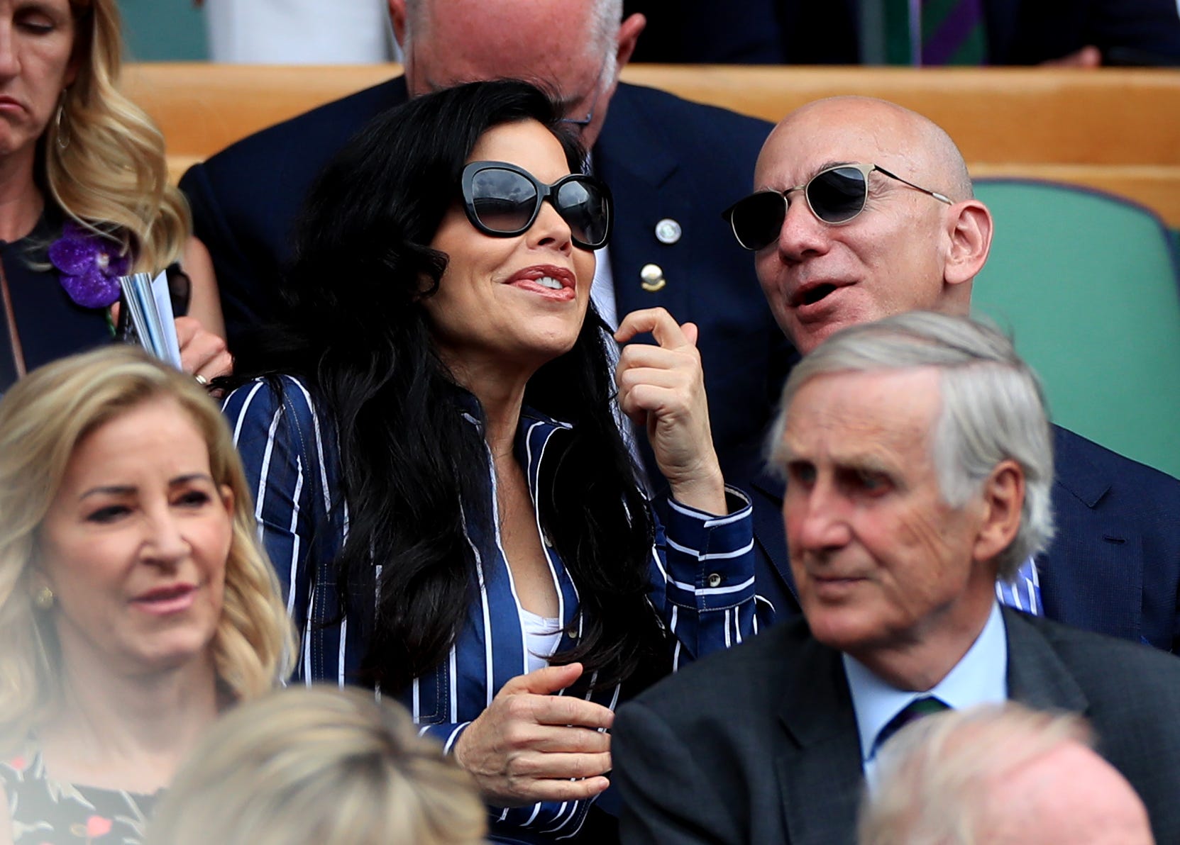 Lauren Sanchez and Jeff Bezos sit in the stands at Wimbledon.