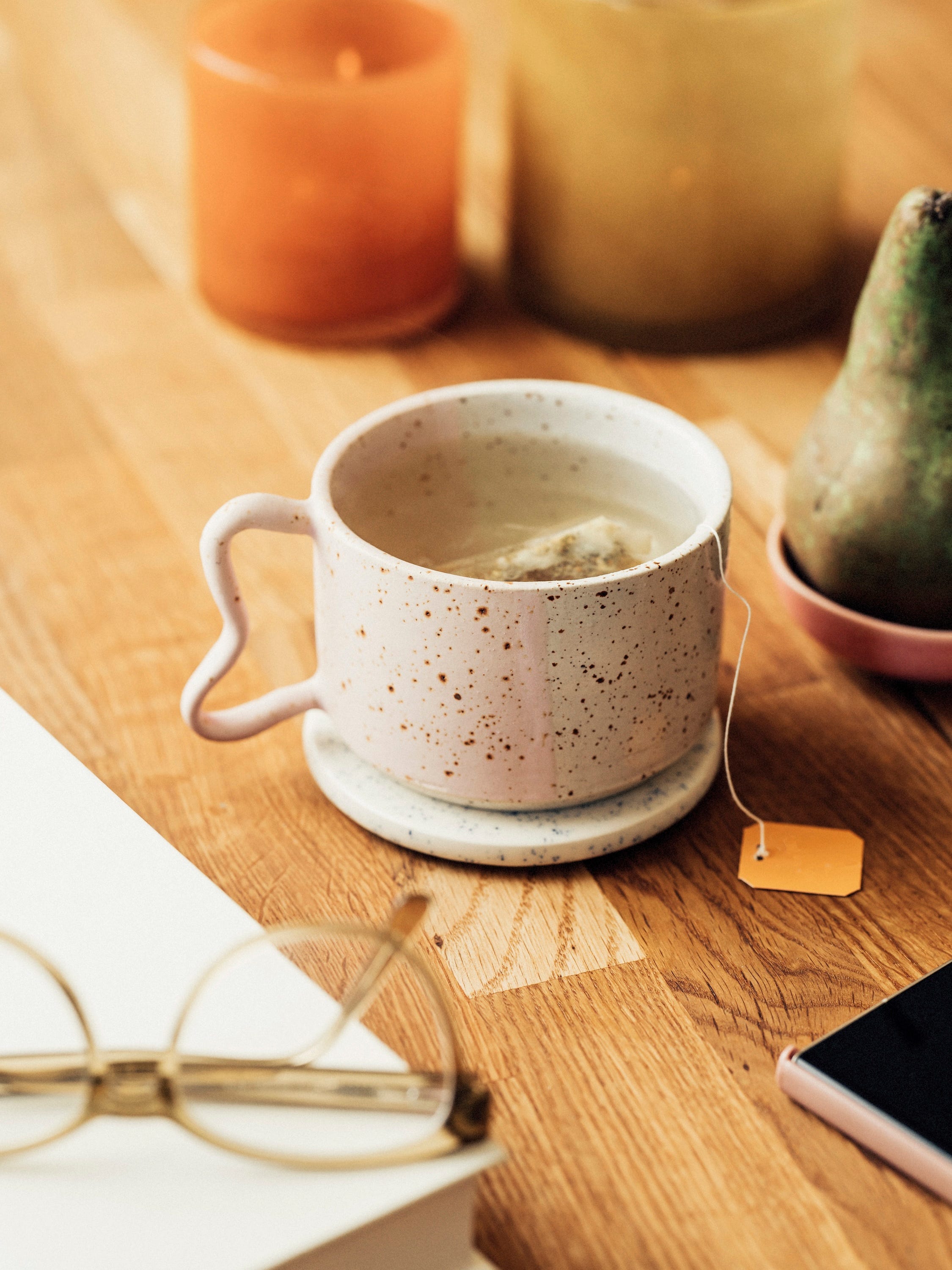 A mug of ginger tea on a table.