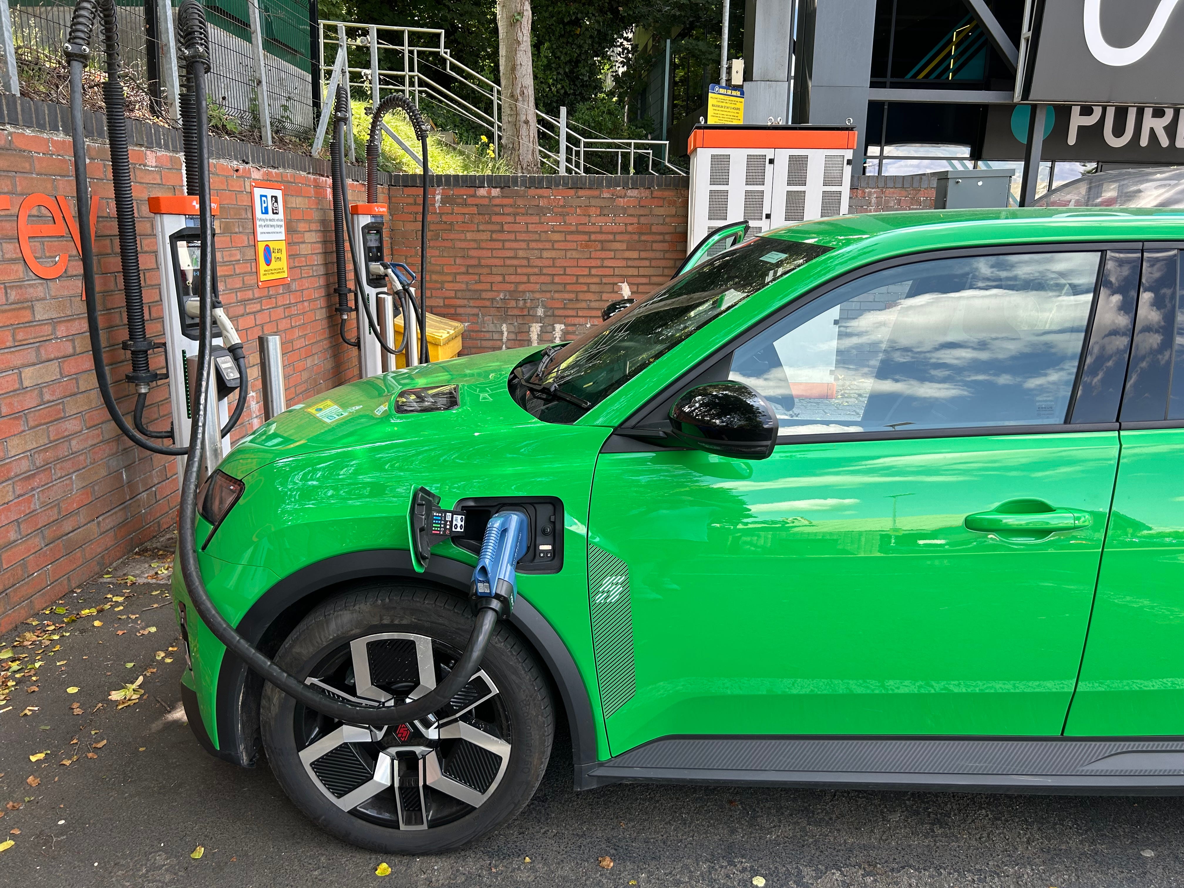 Renault 5 at a charger