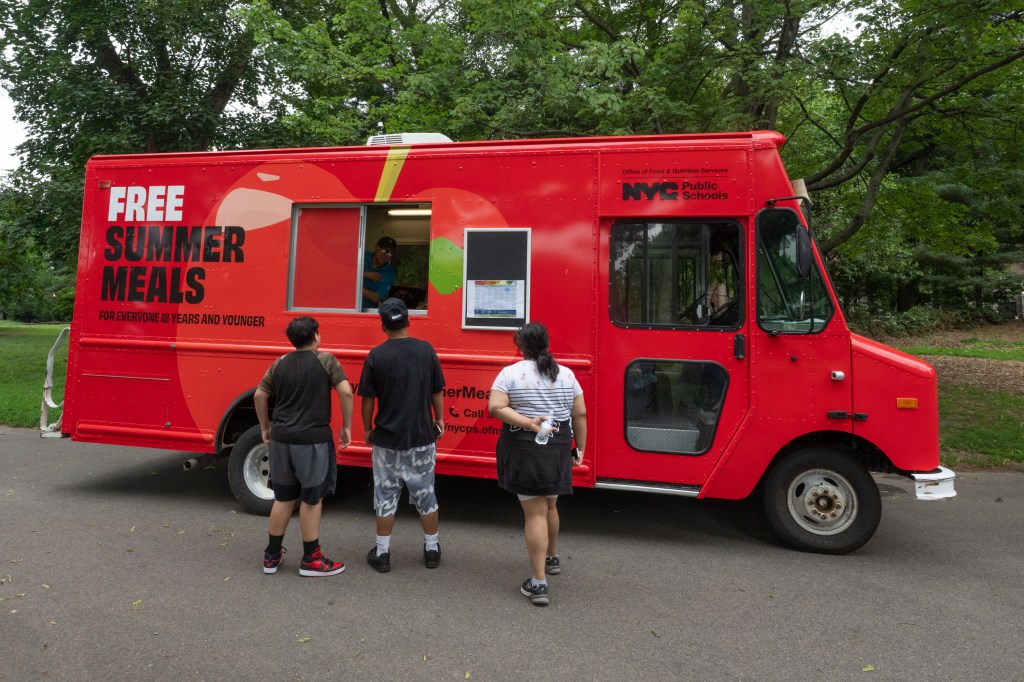 A DOE food truck giving out free summer breakfasts and lunches to youths in Prospect Park, Brooklyn