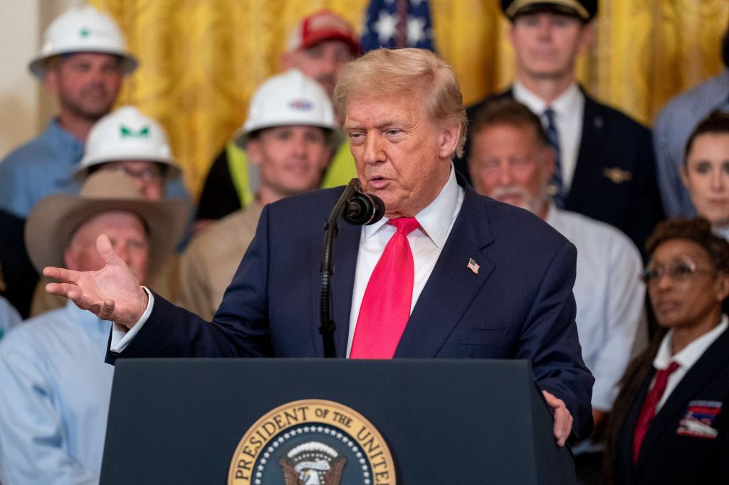 President Donald Trump speaking at a podium.