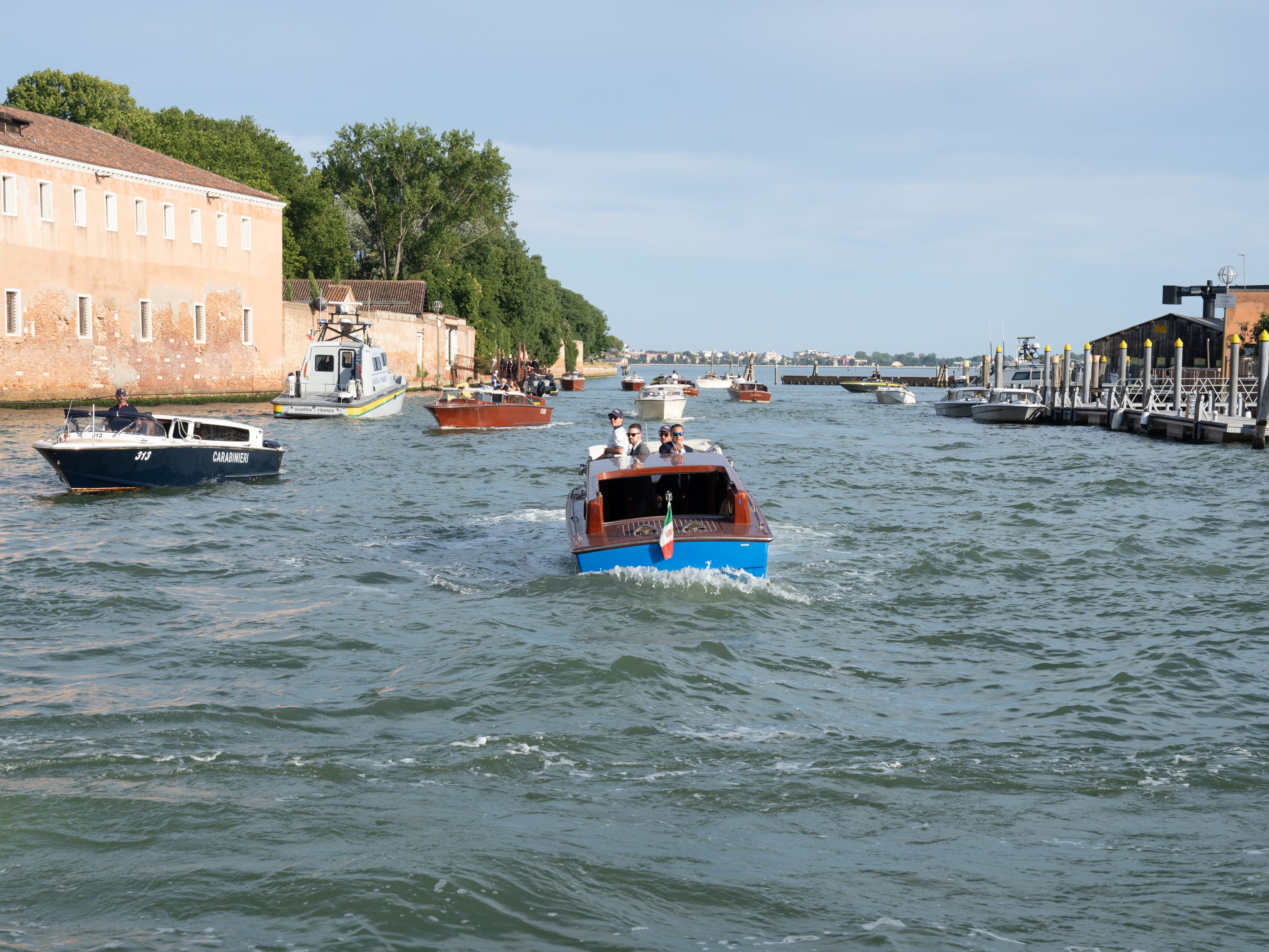 Guests and security accessing party venue on St. Giorgio Island