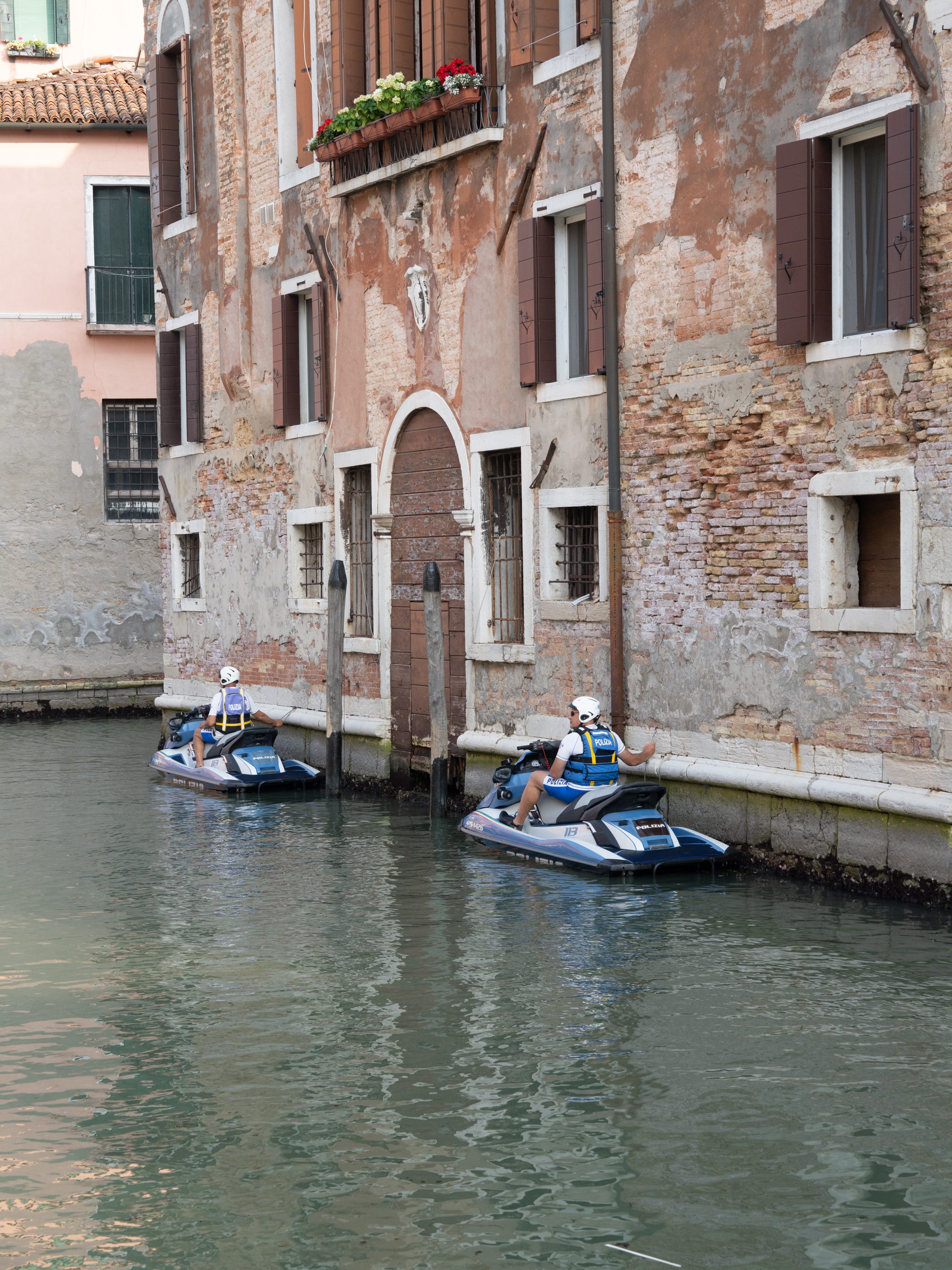 Police checking canals outside party venue Chiesa della Maria dell Orto.