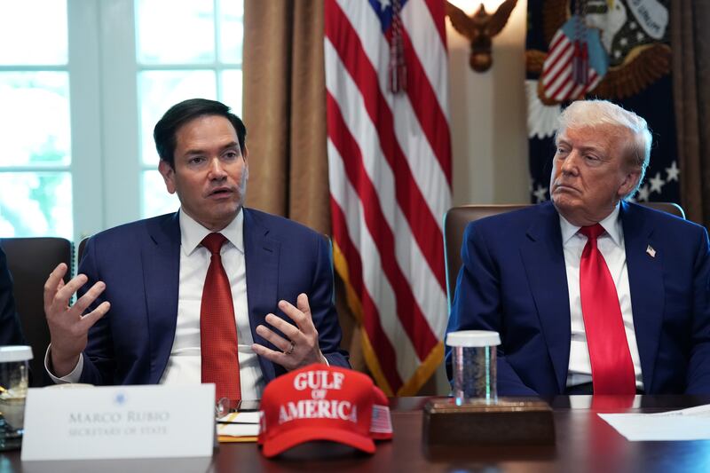 U.S. President Donald Trump listens as U.S. Secretary of State Marco Rubio speaks during a Cabinet meeting.