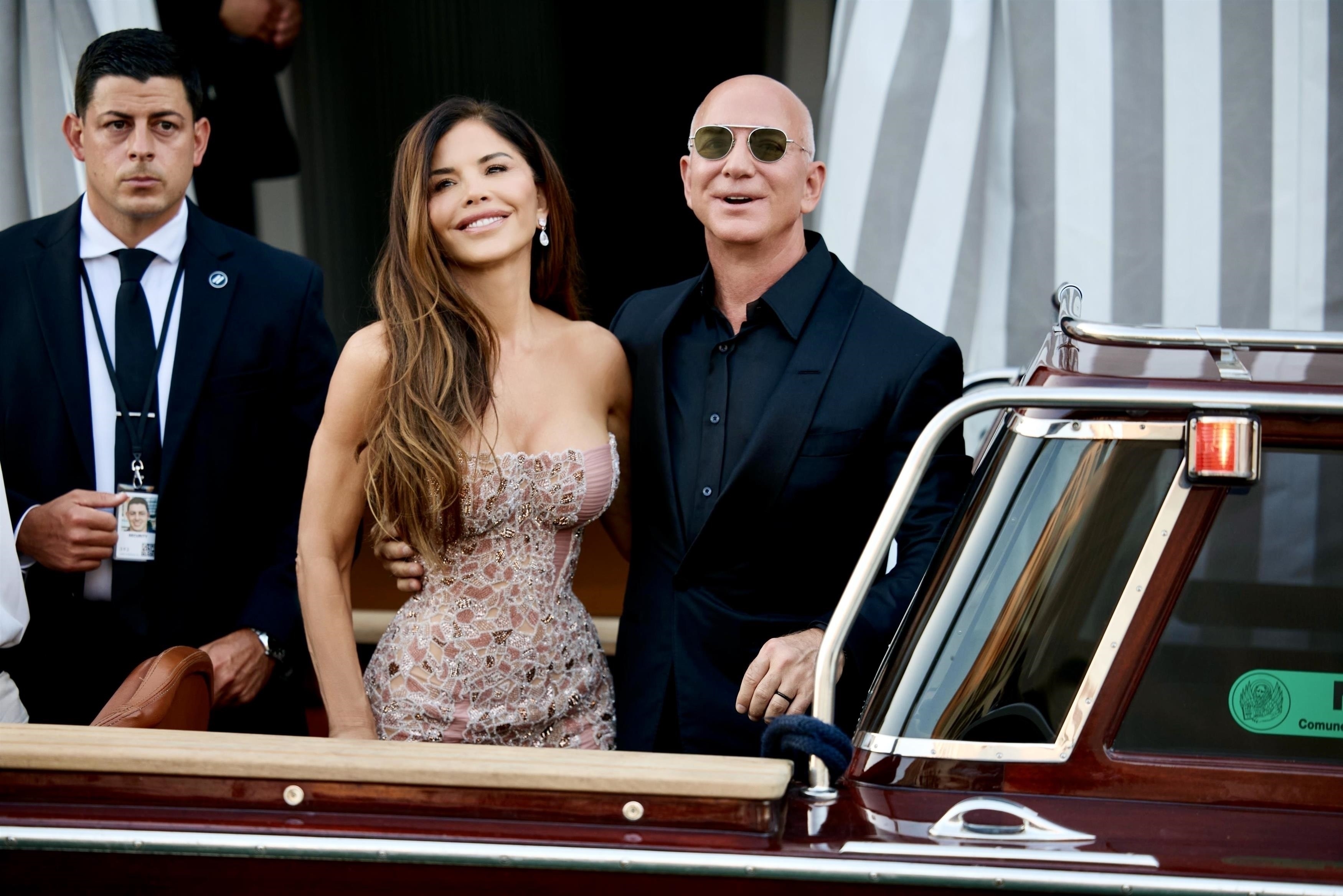 Lauren Sánchez and Jeff Bezos getting into a water taxi.
