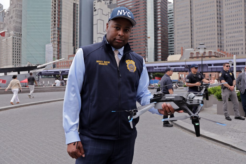 Deputy Mayor Daughtry holding a drone.