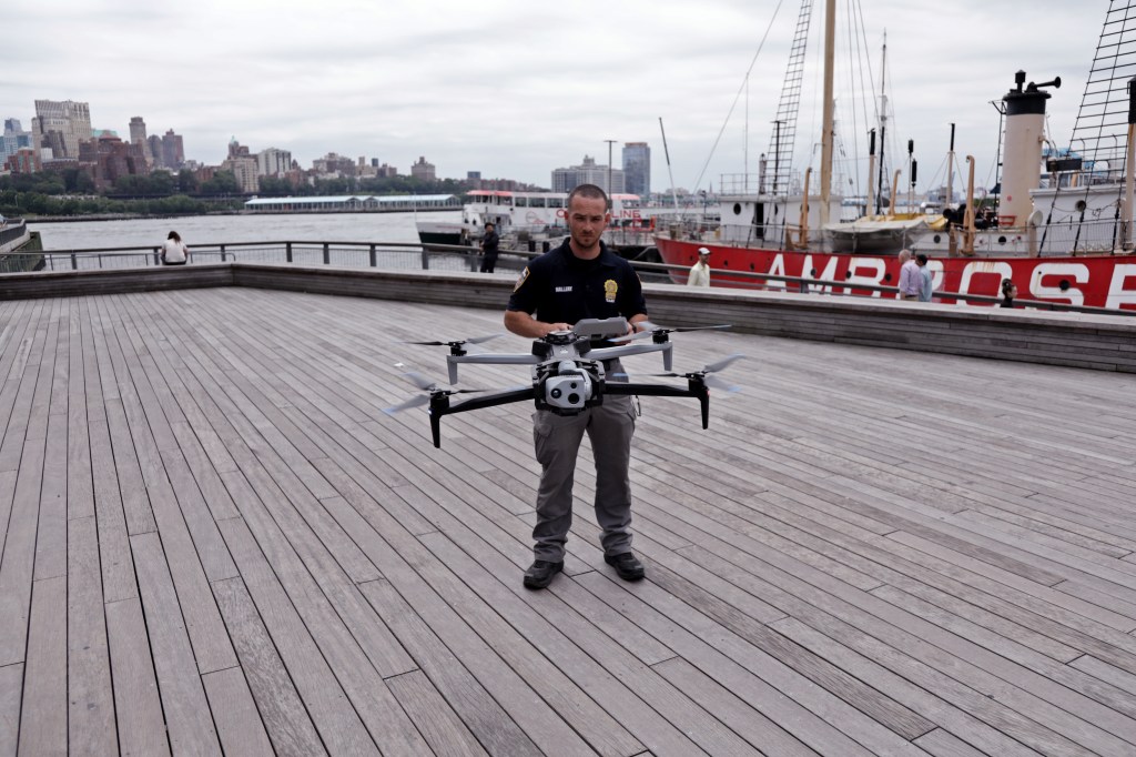 NYPD officer operating a drone.