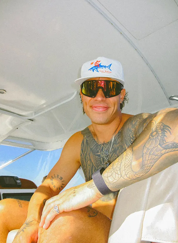 Tanner Mansell, a diver who received a presidential pardon after a felony conviction, on a boat.