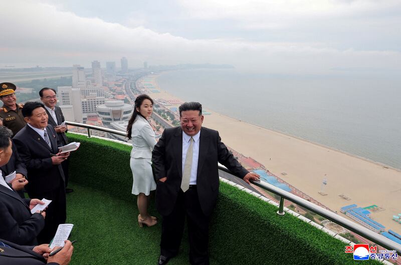 North Korean leader Kim Jong Un and his daughter Kim Ju Ae stand on a balcony facing the beach during a ceremony to celebrate the completion of the Wonsan Kalma Coastal Tourist Zone, in Wonsan, in North Korea, June 24, 2025.  KCNA via REUTERS    ATTENTION EDITORS - THIS IMAGE WAS PROVIDED BY A THIRD PARTY. REUTERS IS UNABLE TO INDEPENDENTLY VERIFY THIS IMAGE. NO THIRD PARTY SALES. SOUTH KOREA OUT. NO COMMERCIAL OR EDITORIAL SALES IN SOUTH KOREA.     TPX IMAGES OF THE DAY