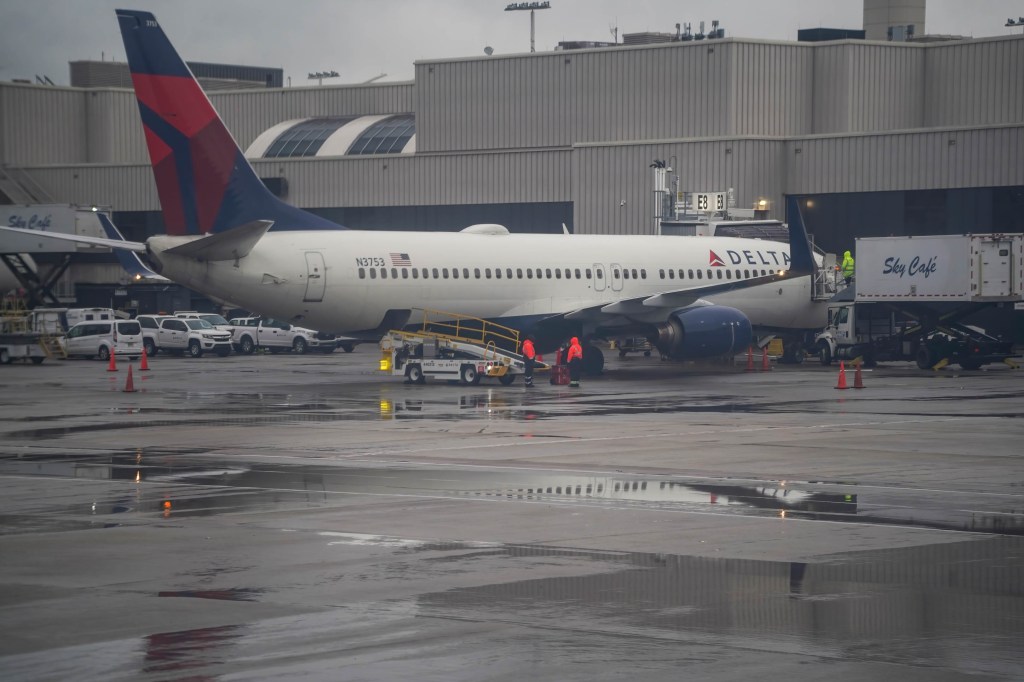 A Delta Airlines flight sits at a gate at Hartsfield-Jackson Atlanta International Airport on April 8, 2023.