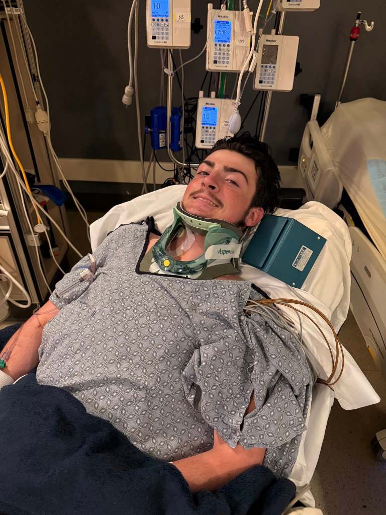 Sloan smiles from his hospital bed on June 27, 2025.
