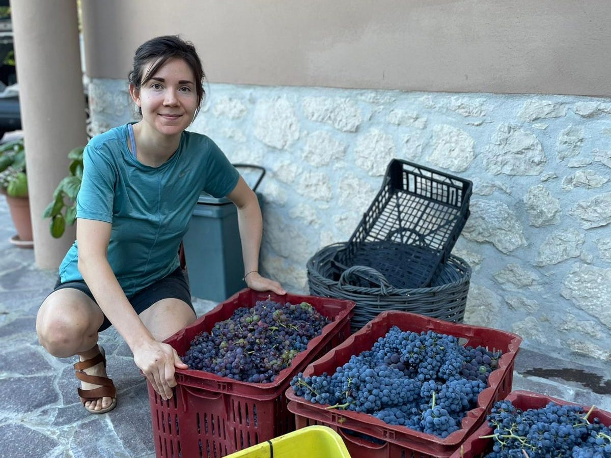 The author with baskets of grapes she and her mother-in-law harvested.