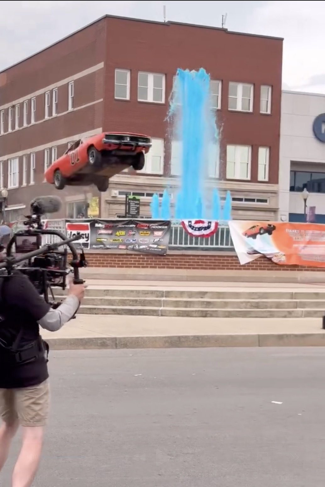 A General Lee car jumping over a fountain.