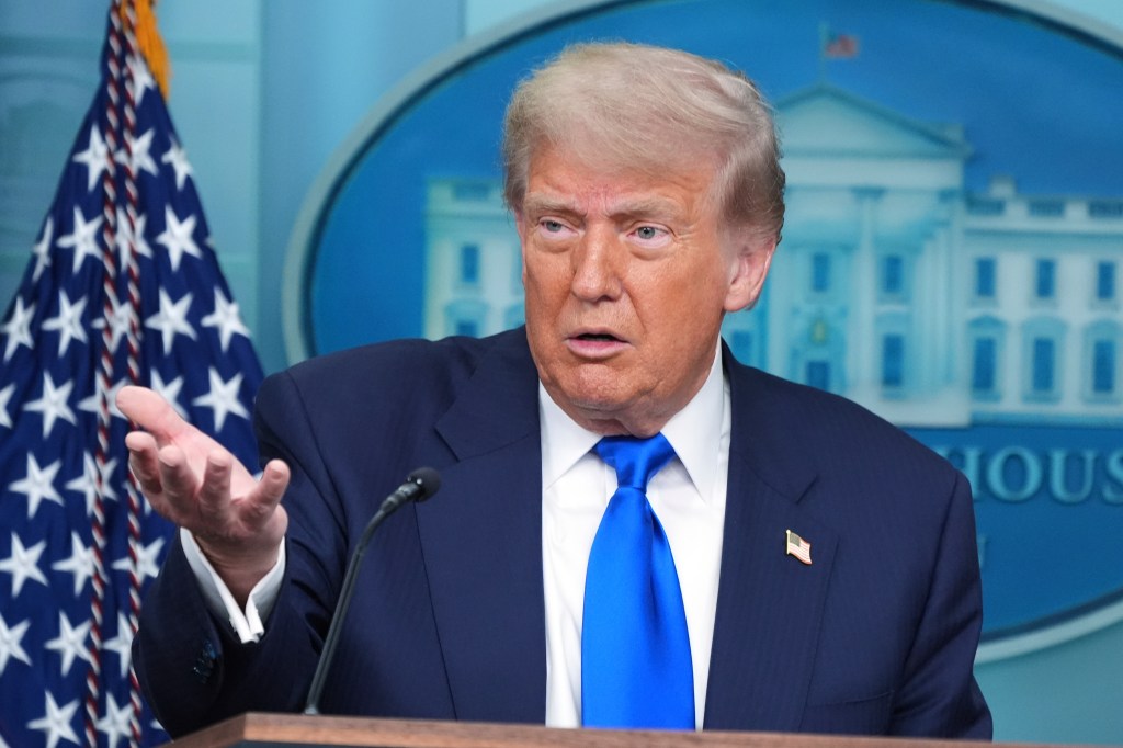 Donald Trump speaking at a press briefing.