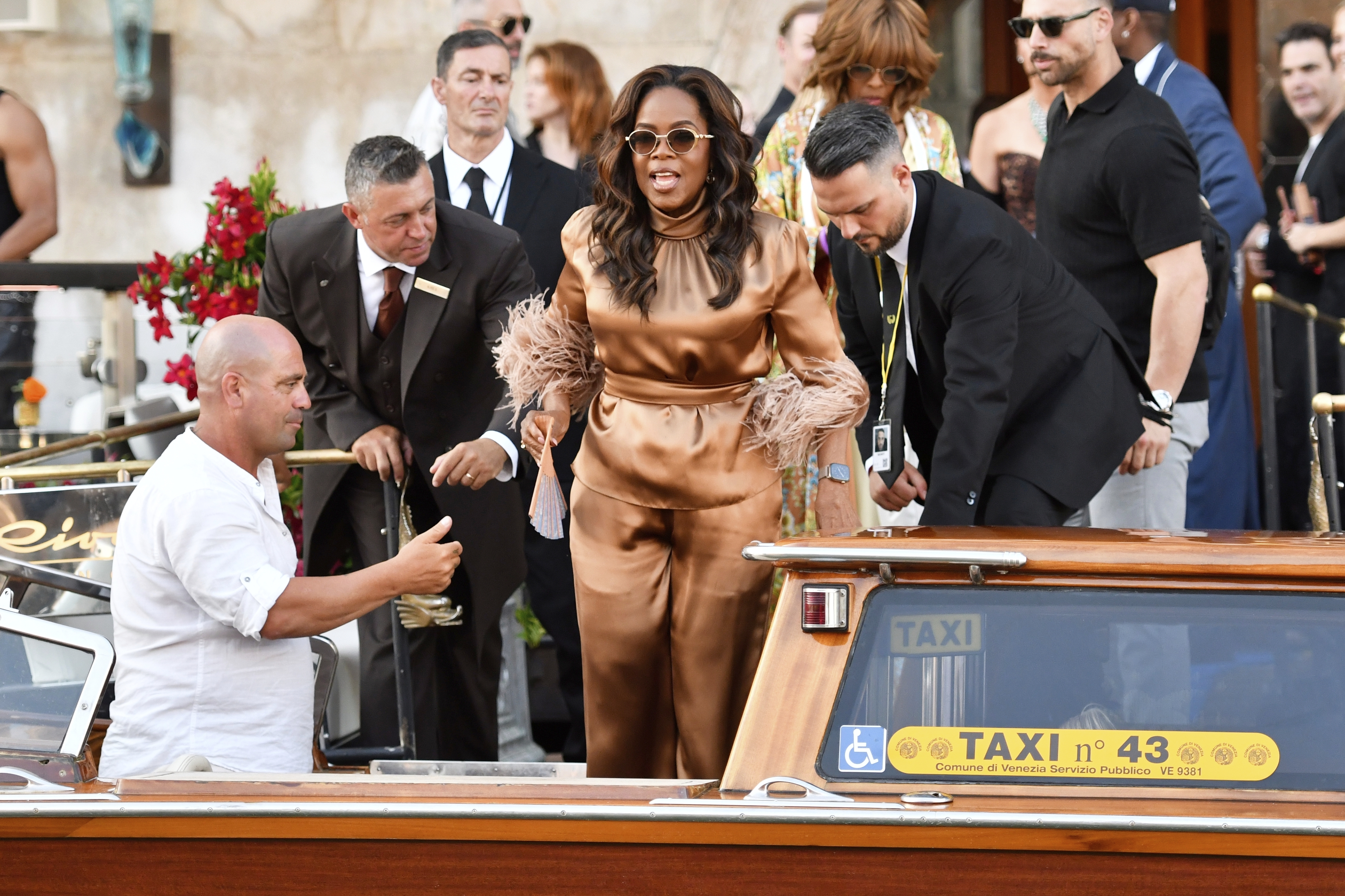 Oprah Winfrey on a water taxi in Venice