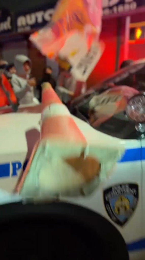 An NYPD vehicle getting attacked at a Ozone Park meetup this year.