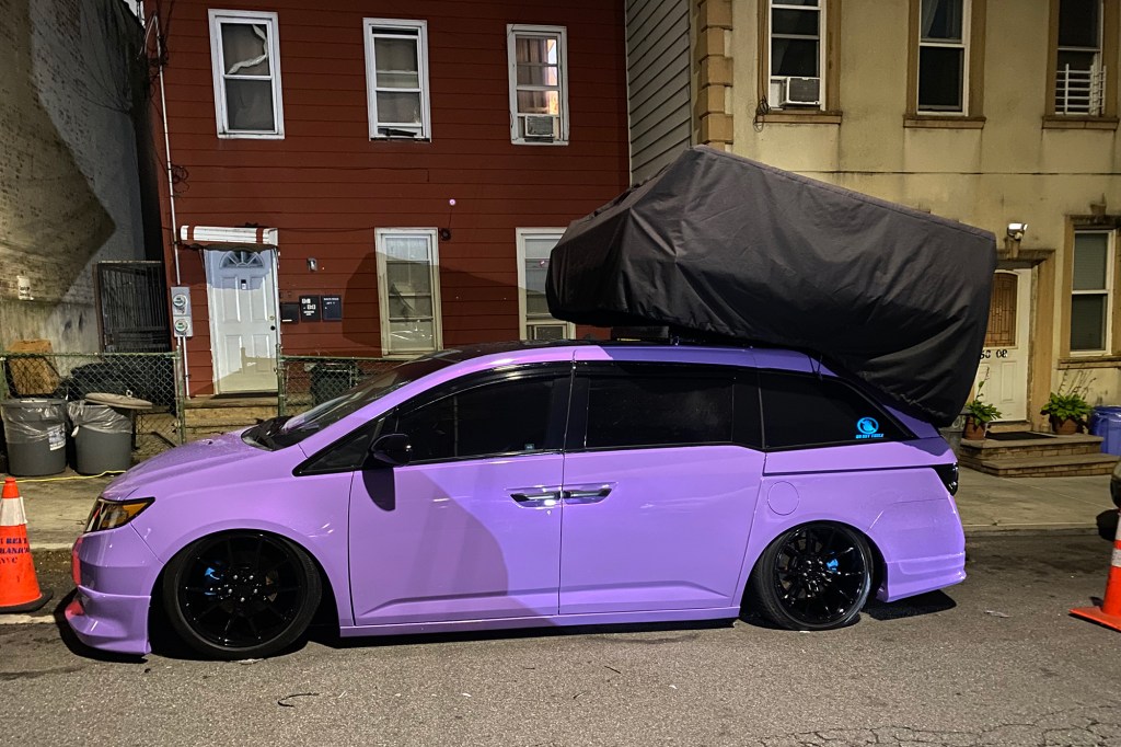 A Honda car in Maspeth, Queens with a speaker attached to the roof for a car meetup