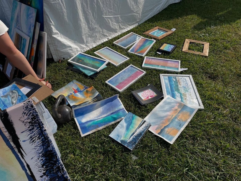 Scattered artwork on the grass after a drunk driving incident.