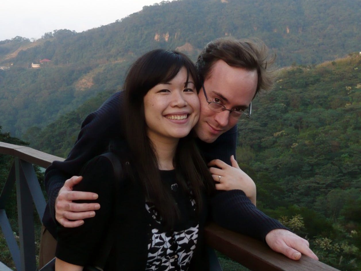 A couple embracing with a scenic background in Taiwan.