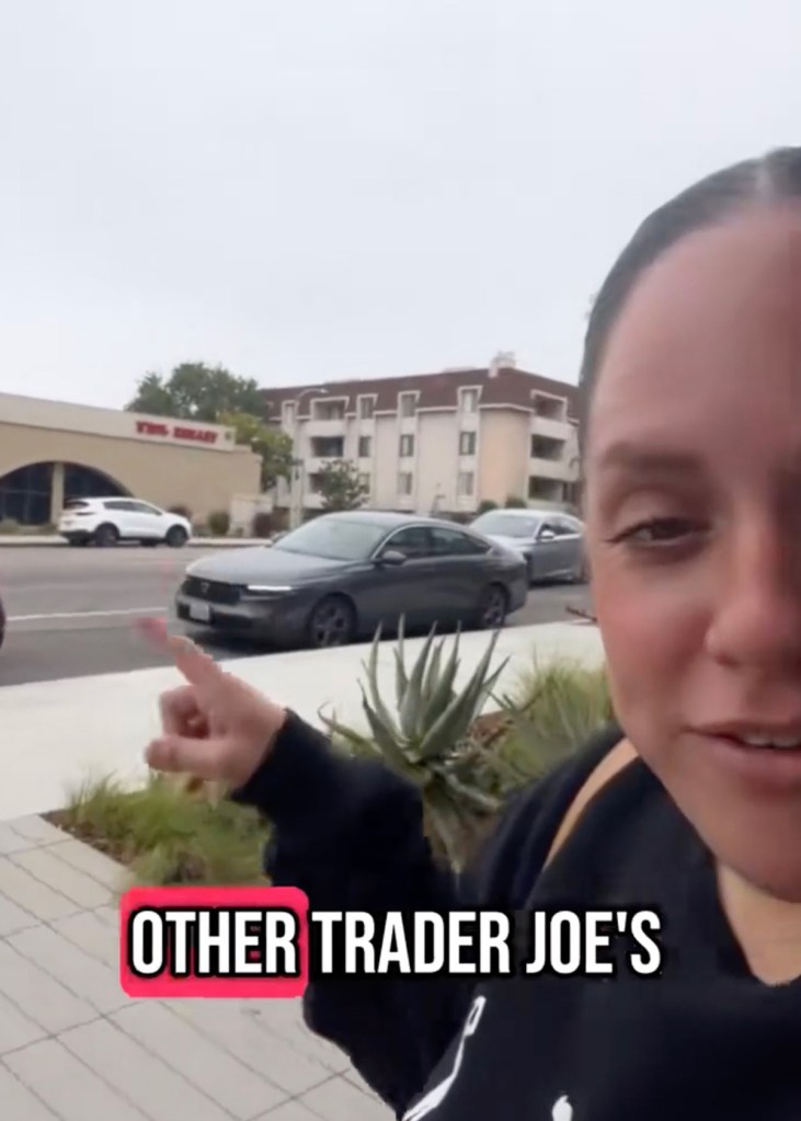 Person pointing towards a new Trader Joe's store across from an existing one.