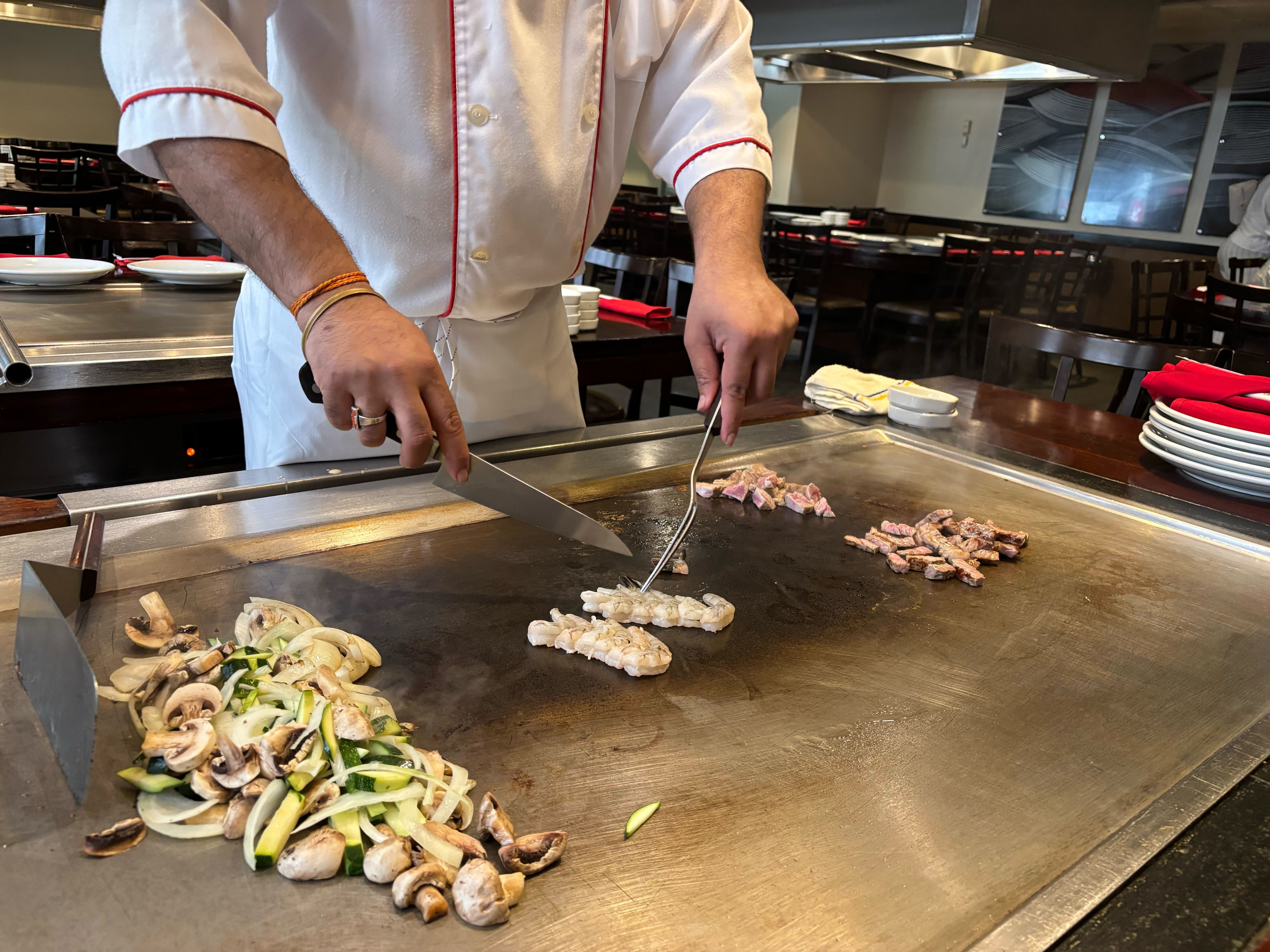 chef grilling up proteins