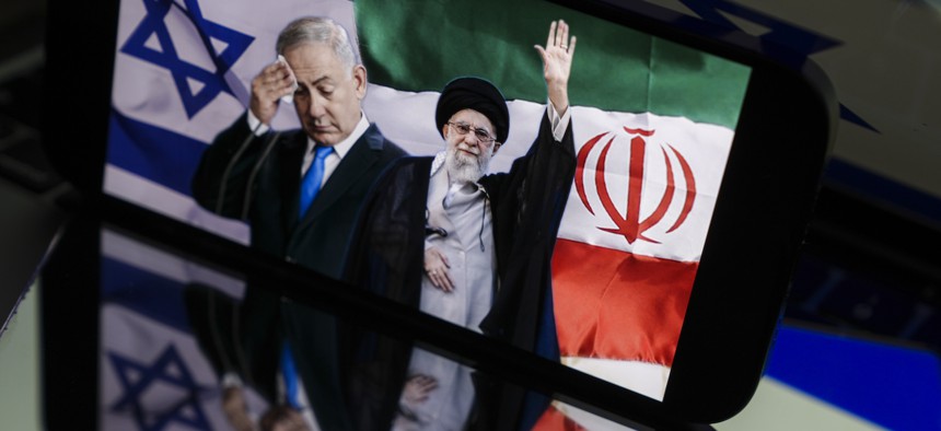 In this photo illustration, Iranian Supreme Leader Ayatollah Ali Khamenei and Israeli Prime Minister Benjamin Netanyahu are seen on a screen, June 24, 2025.