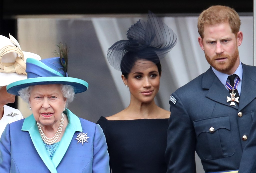 Queen Elizabeth II, Prince Harry and Meghan Markle in July 2018