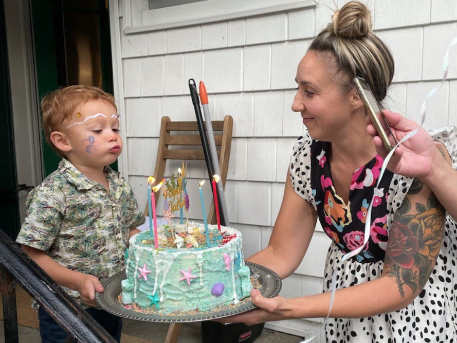 Boy blowing out candles