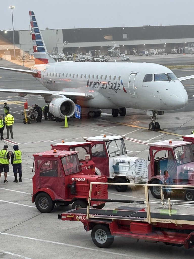 A van collided with an American Eagle plane at Logan Airport.