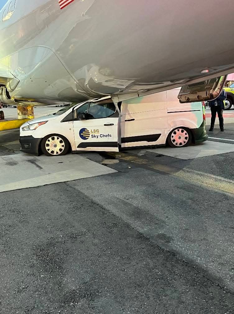 Van crashed into parked plane at Boston airport.
