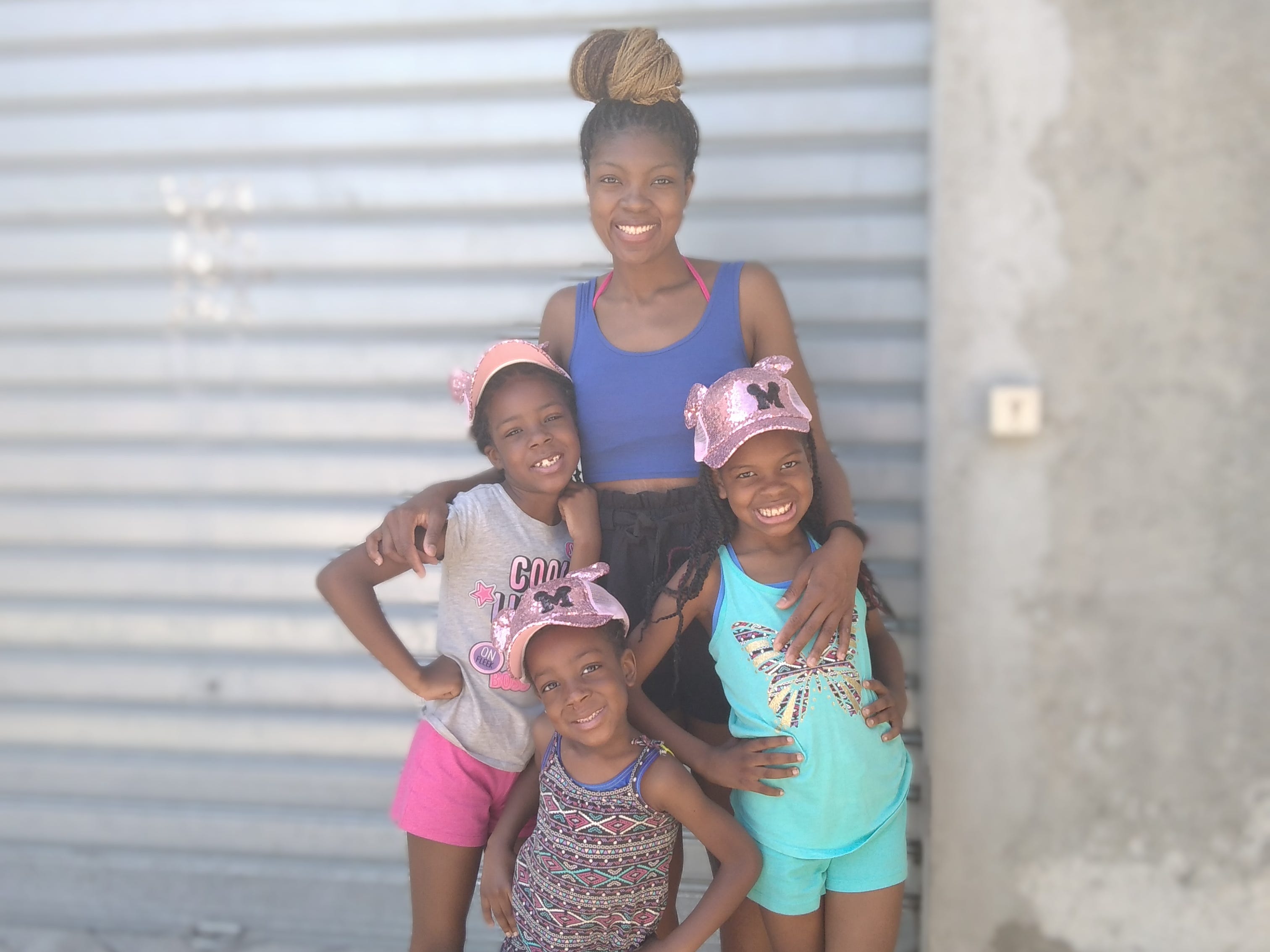 Author Creshonda Smith and her three daughters smiling